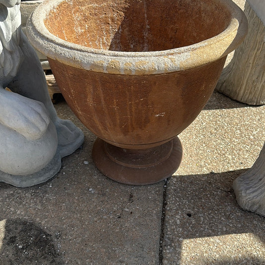 Terra-cotta colored round potting bowl