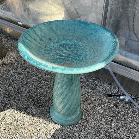 Aqua blue bird bath